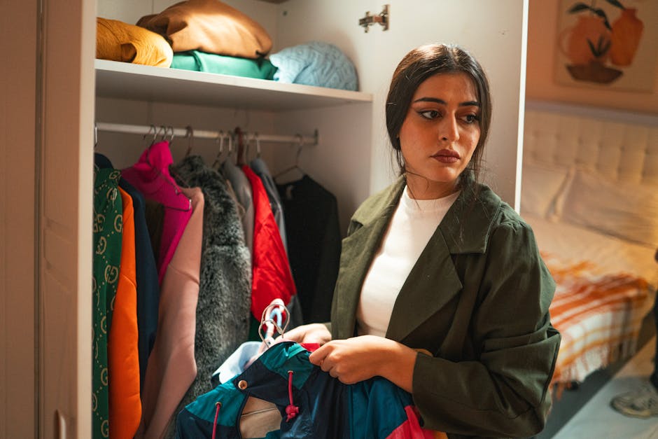 Woman organizing her custom walk-in closet